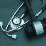 Gavel and stethoscope on wooden background, medical malpractice concept